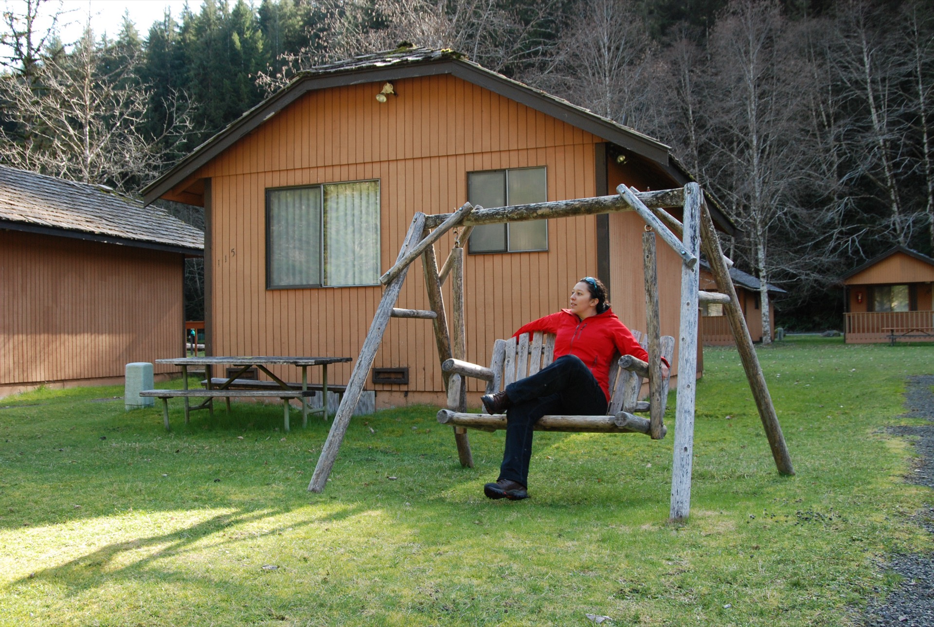 Visitors relaxing at Sol Duc Hot Springs Resort in Olympic National Park, Washington, with tall old-growth firs in the background